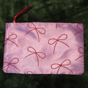 Purple Clutch with Red Bow Design